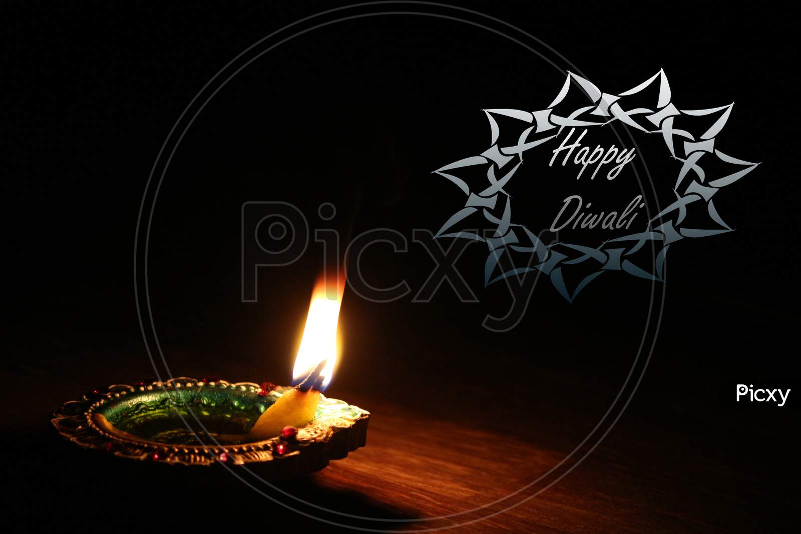 Glowing diya candles on a black background Happy diwali wish mesaage greetings