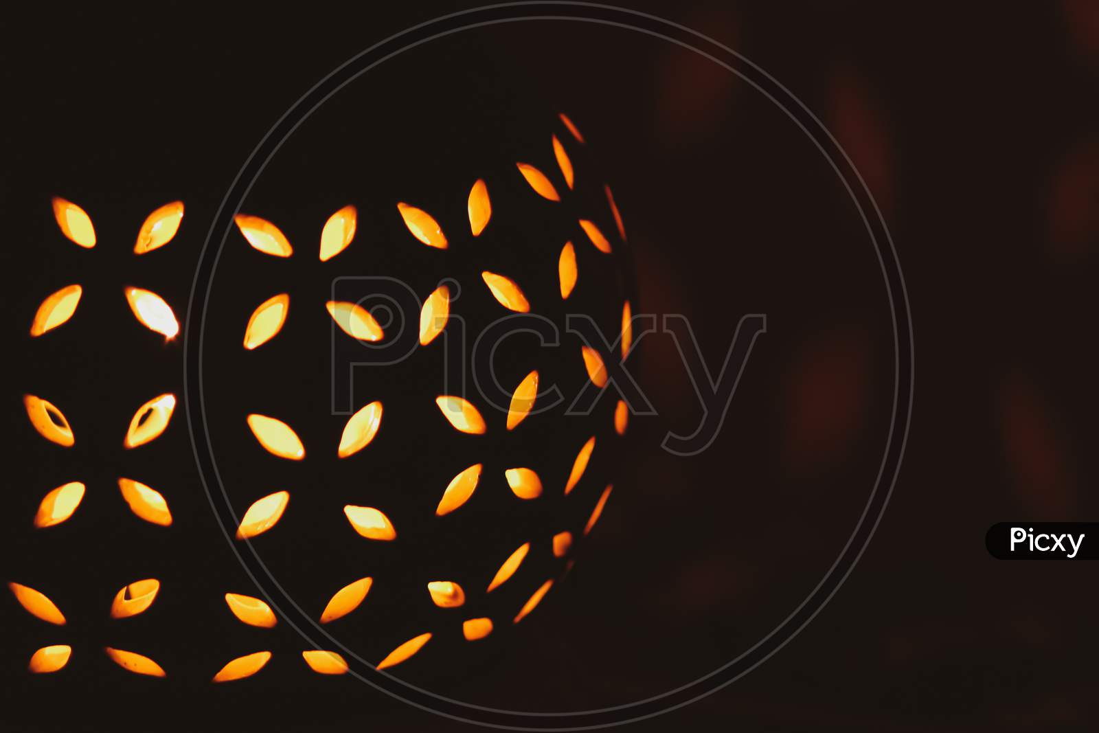 abstract orange Halloween  ball glowing light on black background