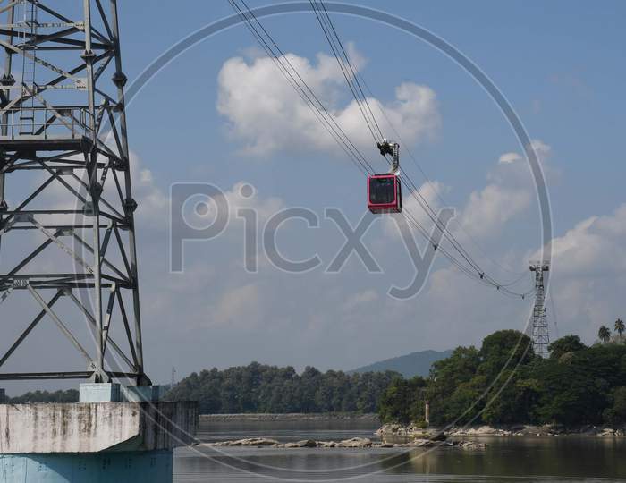 People travel on a cable car cabin in the India's longest river ropeway which connects the northern and southern banks of the Brahmaputra river in Guwahati on Oct 18,2020
