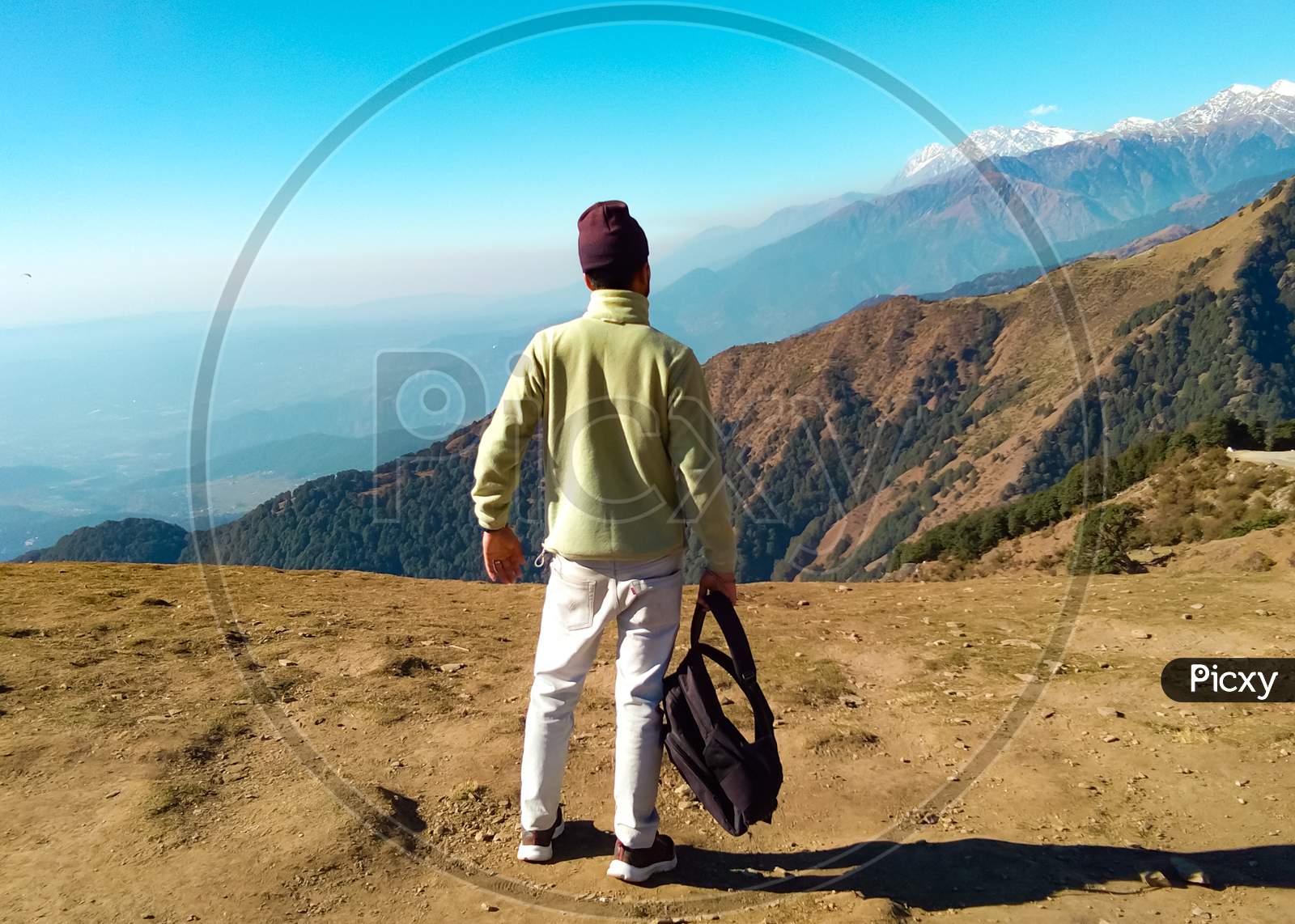 Picture Of A Boy Standing And Holding His Bag In Hands At Bir Billing (Highest Paragliding Site In India) Himachal Pradesh
