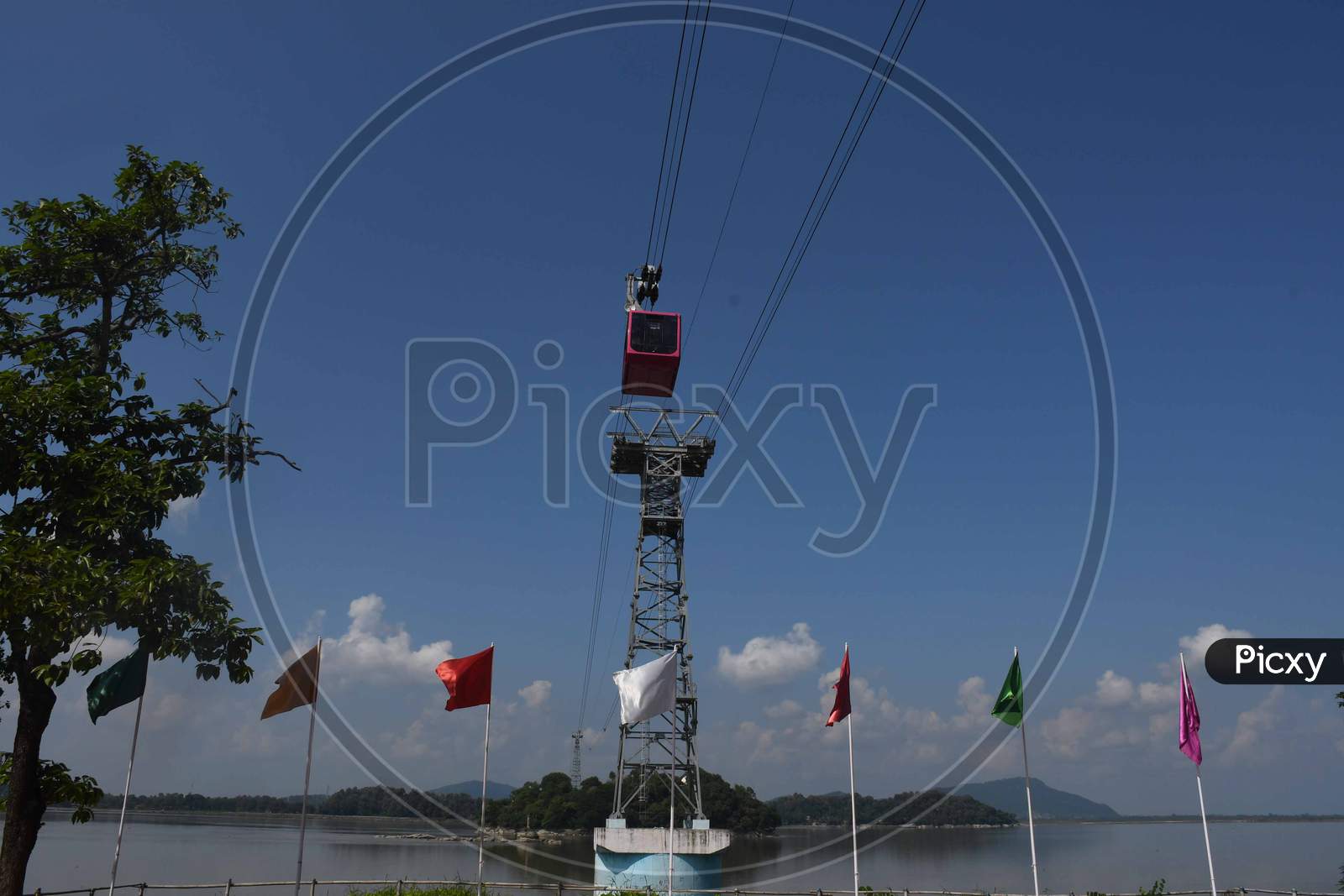 People travel on a cable car cabin in the India's longest river ropeway which connects the northern and southern banks of the Brahmaputra river in Guwahati on Oct 18,2020