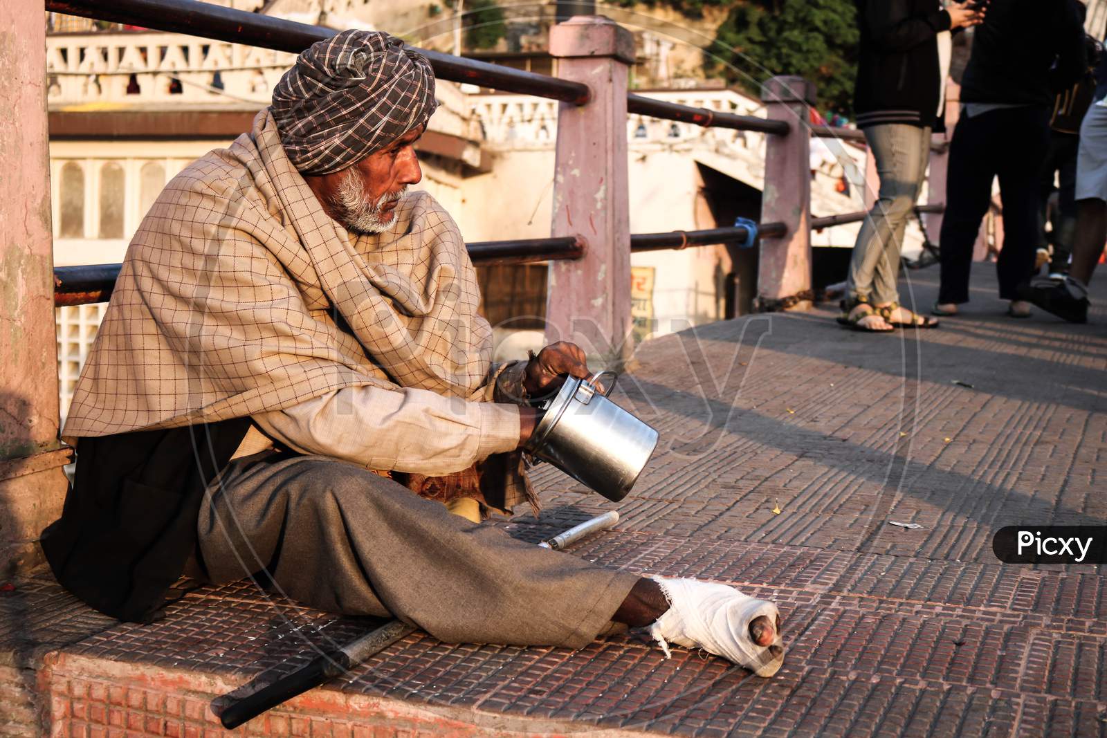 Image of beggar sitting behind the road-EE308443-Picxy