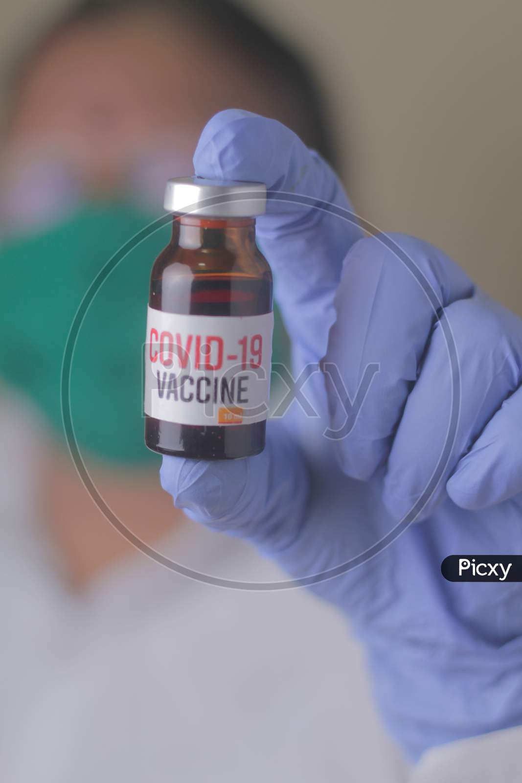 Doctor, Nurse, Scientist, Researcher Hand In Blue Gloves Holding Flu, Measles, Coronavirus, Covid-19 Vaccine Disease Preparing For Human Clinical Trials Vaccination Shot, Medicine And Drug Concept.