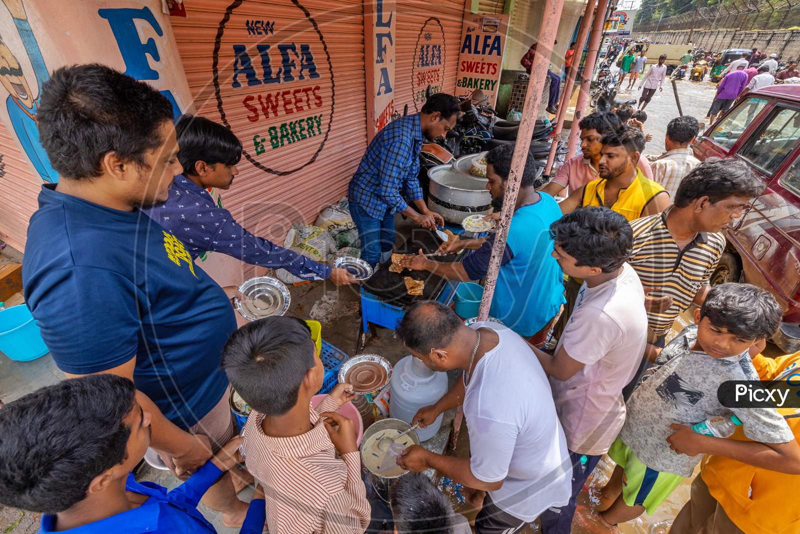 Volunteers making & distributing food & water to the locals of hafiz baba nagar