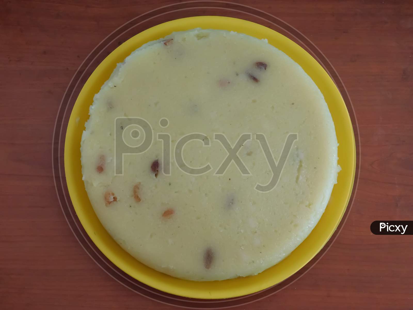 Closeup Of A Delicious Sweet Food In A Plate Isolated On Wooden Surface