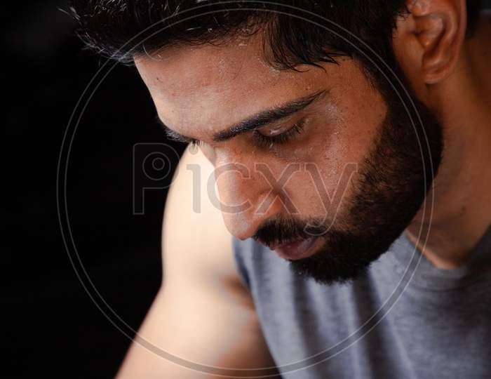 Closeup Of Beard Man Cleaning Sweat With Towel After Workout