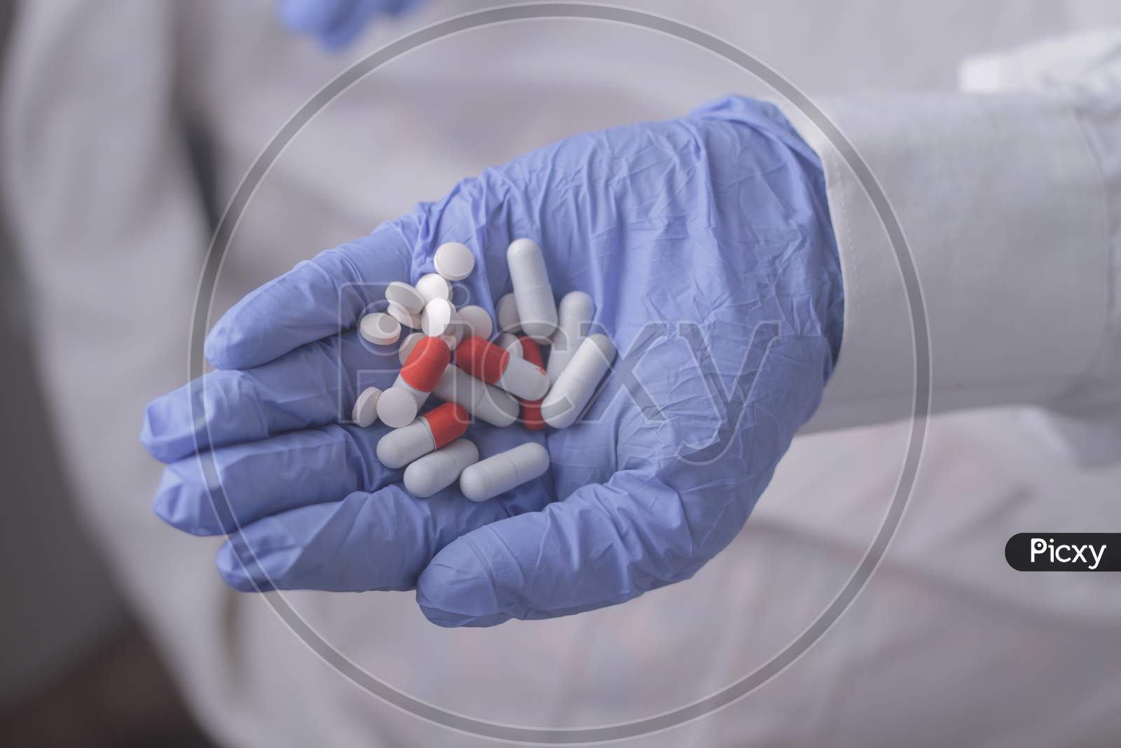Capsules And Tablets In Hand Stock Photo