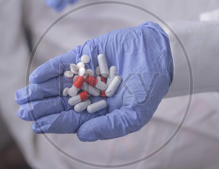 Capsules And Tablets In Hand Stock Photo