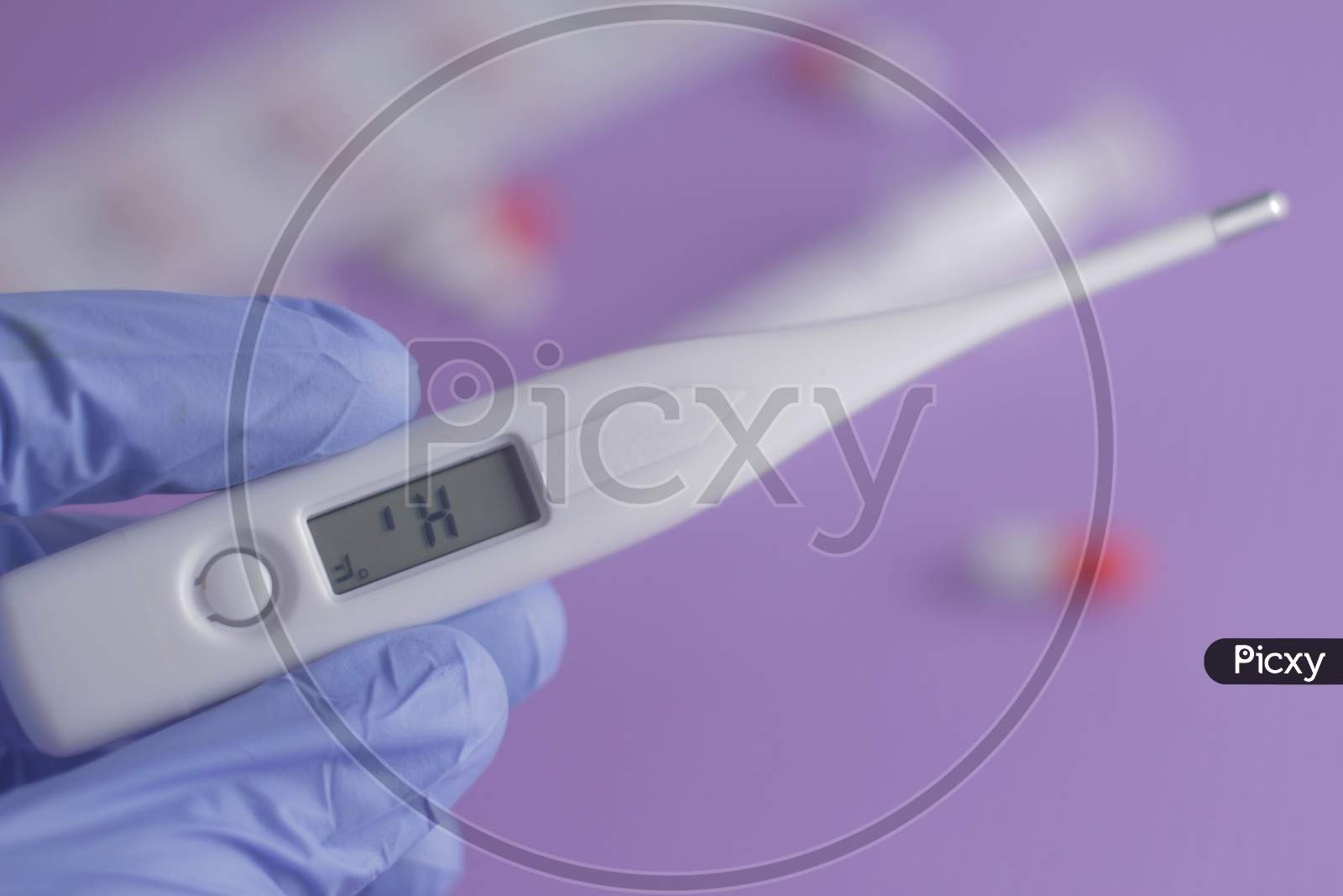 Close Up Man Hand Holding Thermometer. Health Care And Medical Concept.