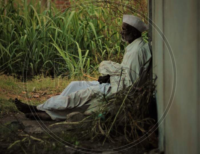 Tired Maharashtrian farmer
