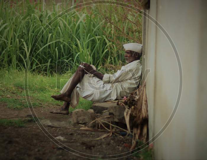 Tired Maharashtrian farmer