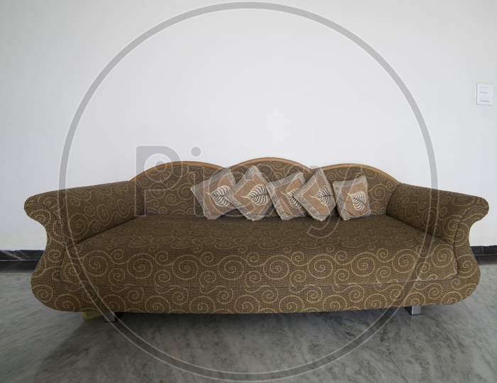 brown couch on floor