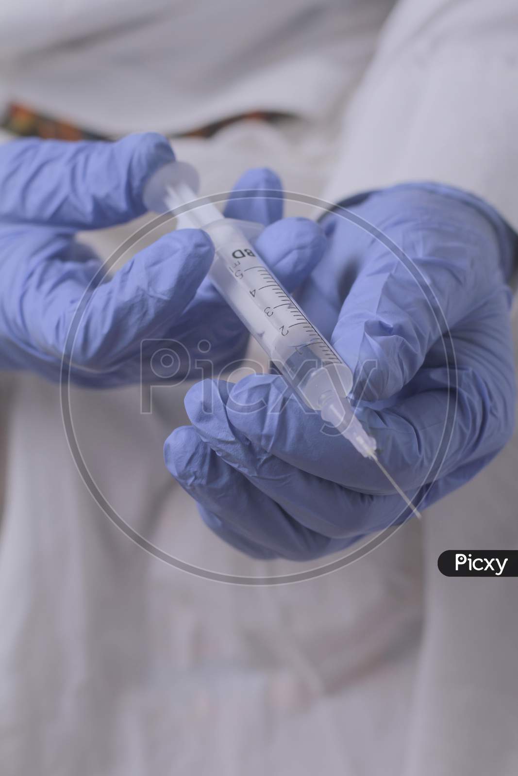 Close Up Of Women Doctor Holding Syringe With Injection