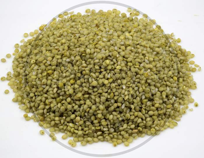 Close-Up Of Brown Millet Grains On A  White Background