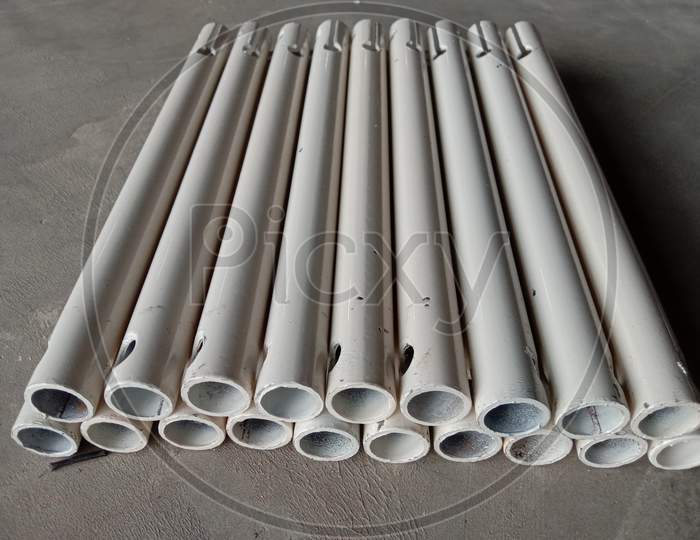 White Colored Pipe Stock On Floor