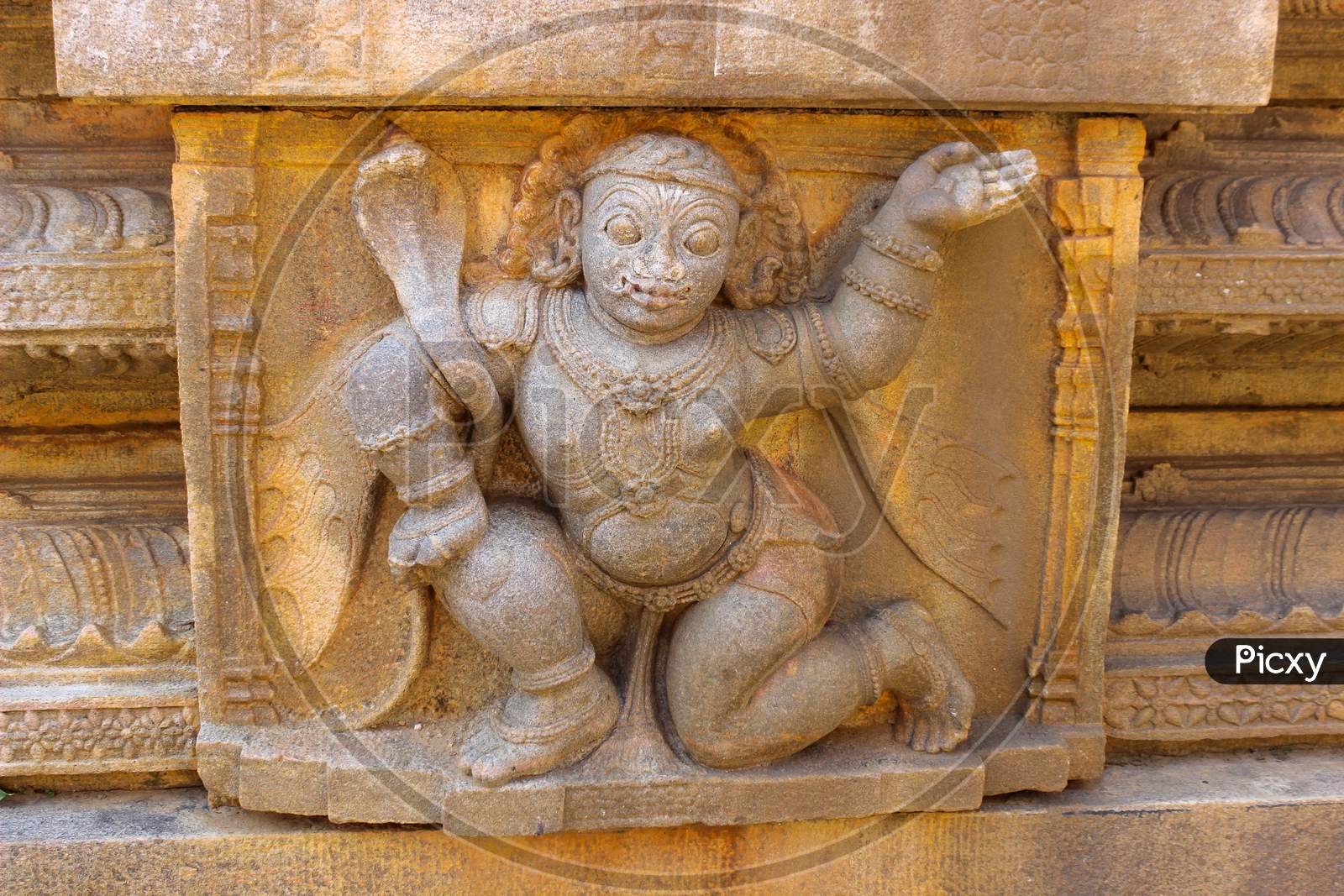 A beautiful Stone Carving of a Deity on a Pillar of a Hindu Temple at Melukote town near Mysuru in Karnataka state of India.