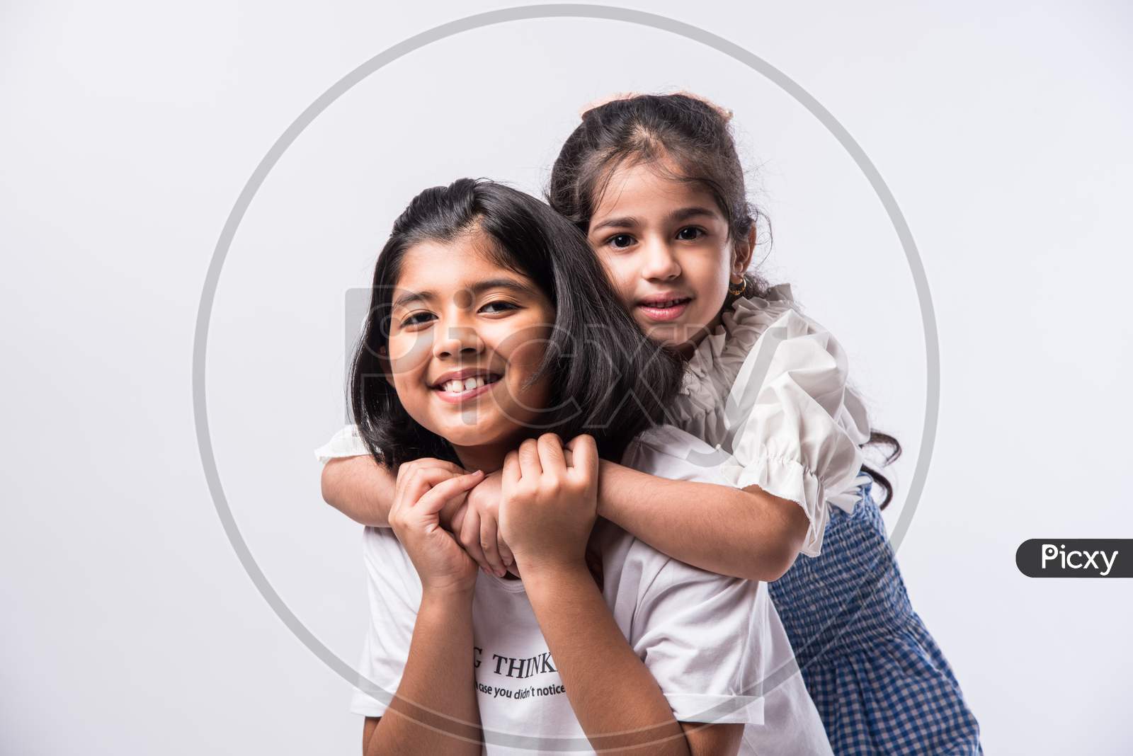 Cute Little Indian Asian Siblings Standing Together Close Isolated Against White Background