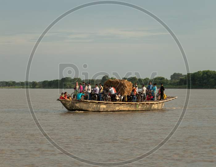 Boat Crossing River Stock Photo
