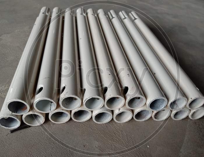 White Colored Pipe Stock On Floor