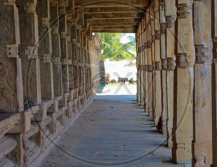 An Elegant view of the Stone pillar Passage of an Ancient Shiva temple at Melukote religious town near Mysuru in Karnataka/India.