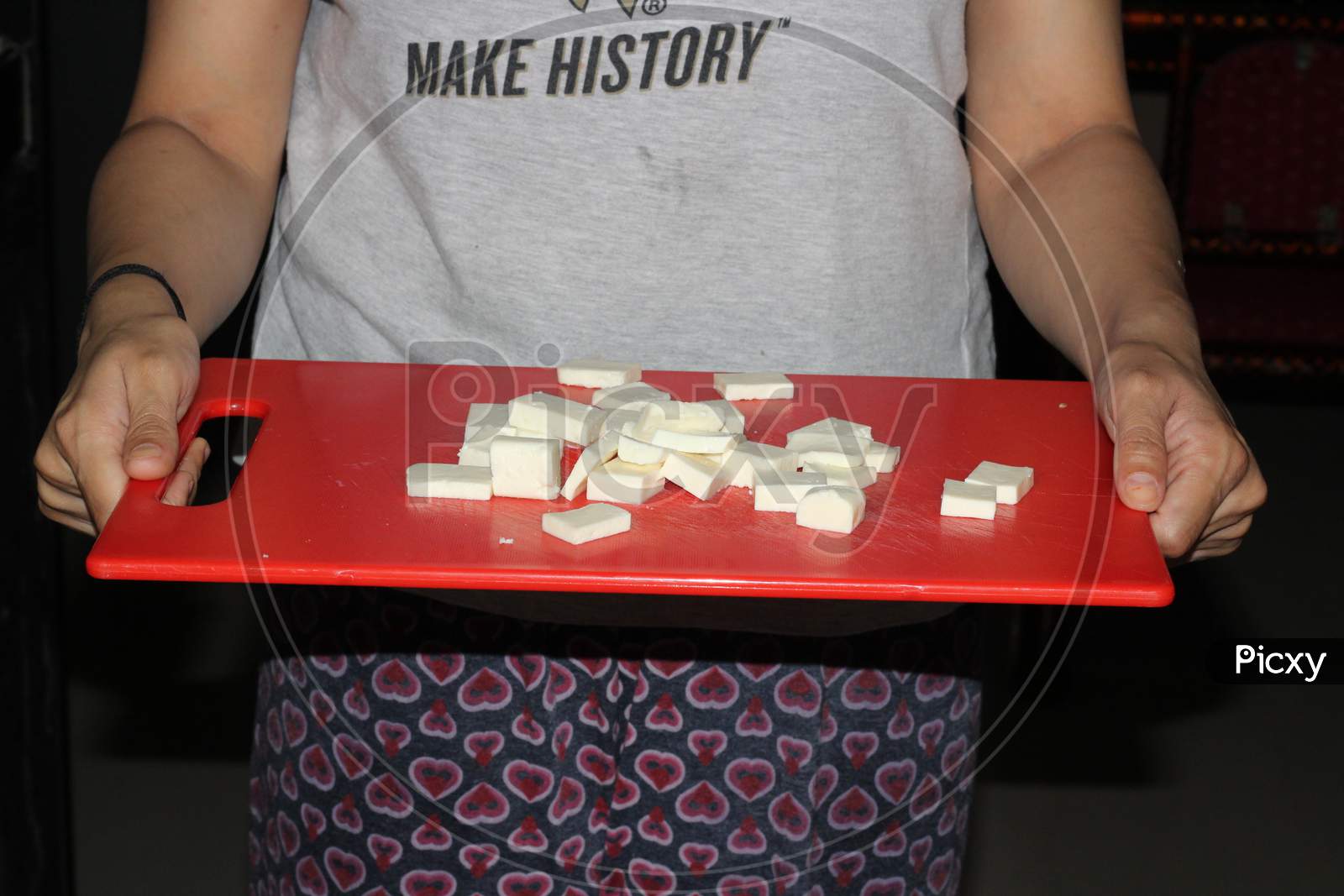 Image Of Closeup Of Paneer Cut Into Pieces On Cutting Board-of779398-picxy