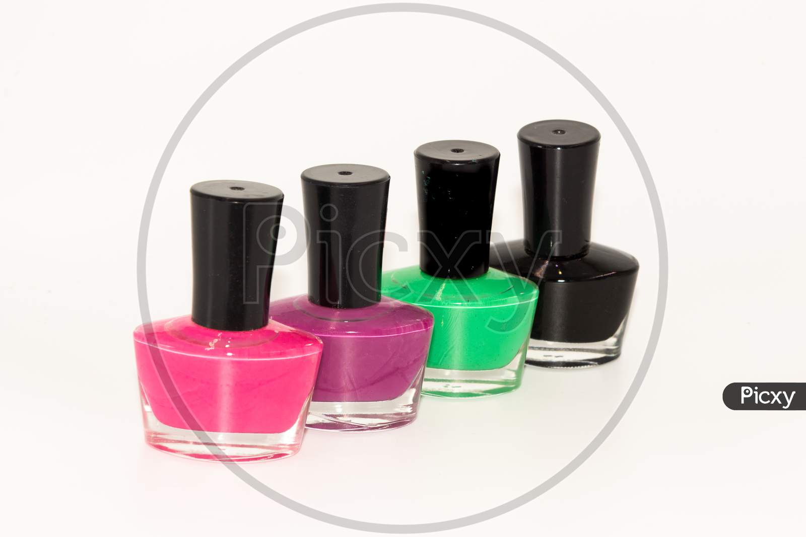 Colored nail polish kept on display with white background