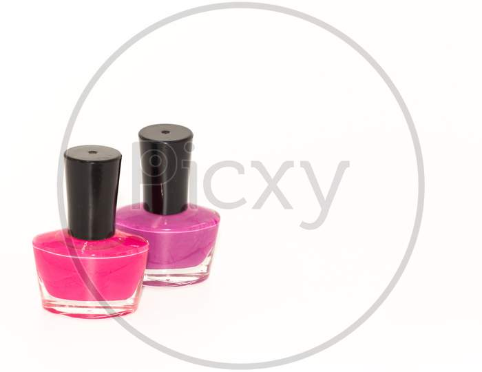 Colored nail polish kept on display with white background