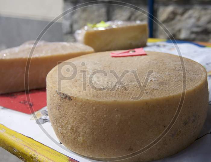 Swiss Cheese Wheel On Market Table