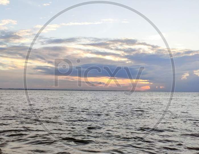 Background Of Colorful Sky On Water Concept: Dramatic Sunset With Twilight Color Sky And Clouds