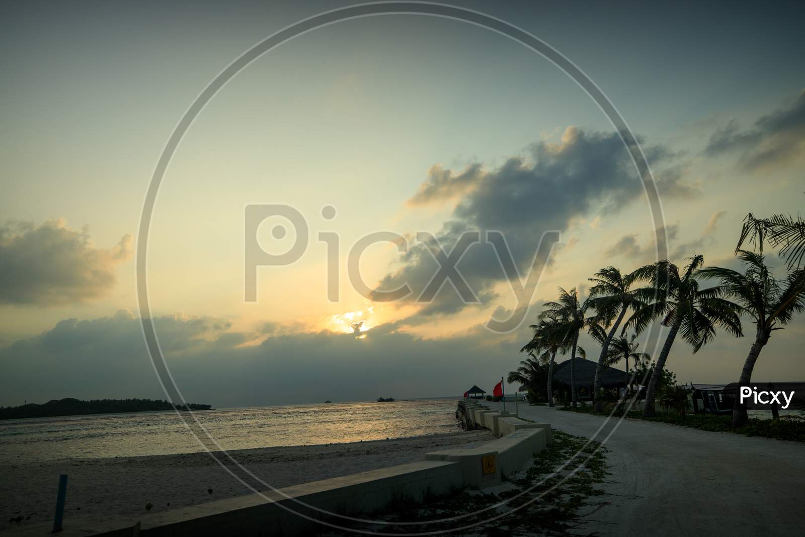 Huvafen Fushi Resort Maldives beach sunset