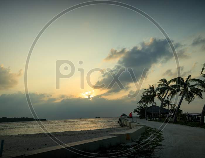 Huvafen Fushi Resort Maldives beach sunset