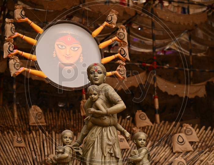 Maa Durga idol as migrant worker displayed for Durga Puja festival at "Behala Barisha club" in Kolkata, West Bengal.