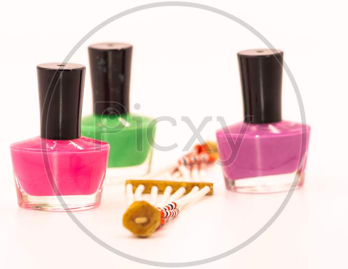 Bottles of colored nail polish and a brace-late