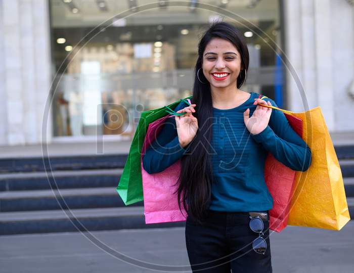 Indian young woman shopping