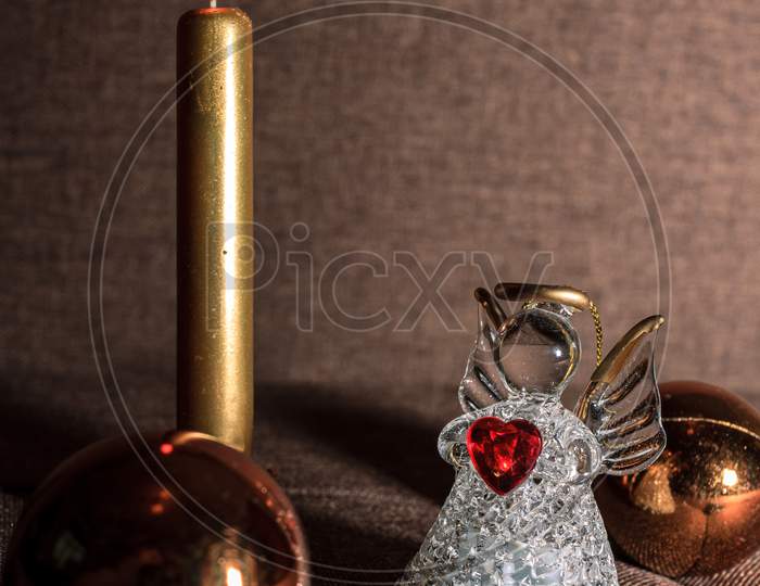 Glass Christmas Decoration And Gold Candle
