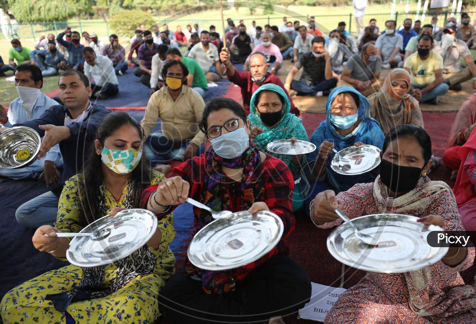 Non-Gazetted employees holding utensils during protest against University VC in support of their various demands, in Jammu on october.21,2020.