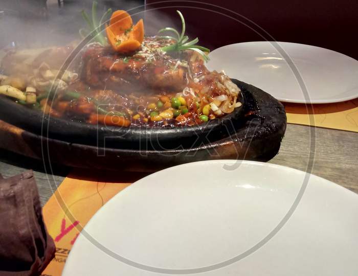 Sizzlers food with steam coming out photography