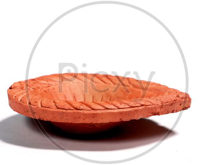 Close Up Of A Beautifully Designer Handmade Clay Lamp Isolated On White Background