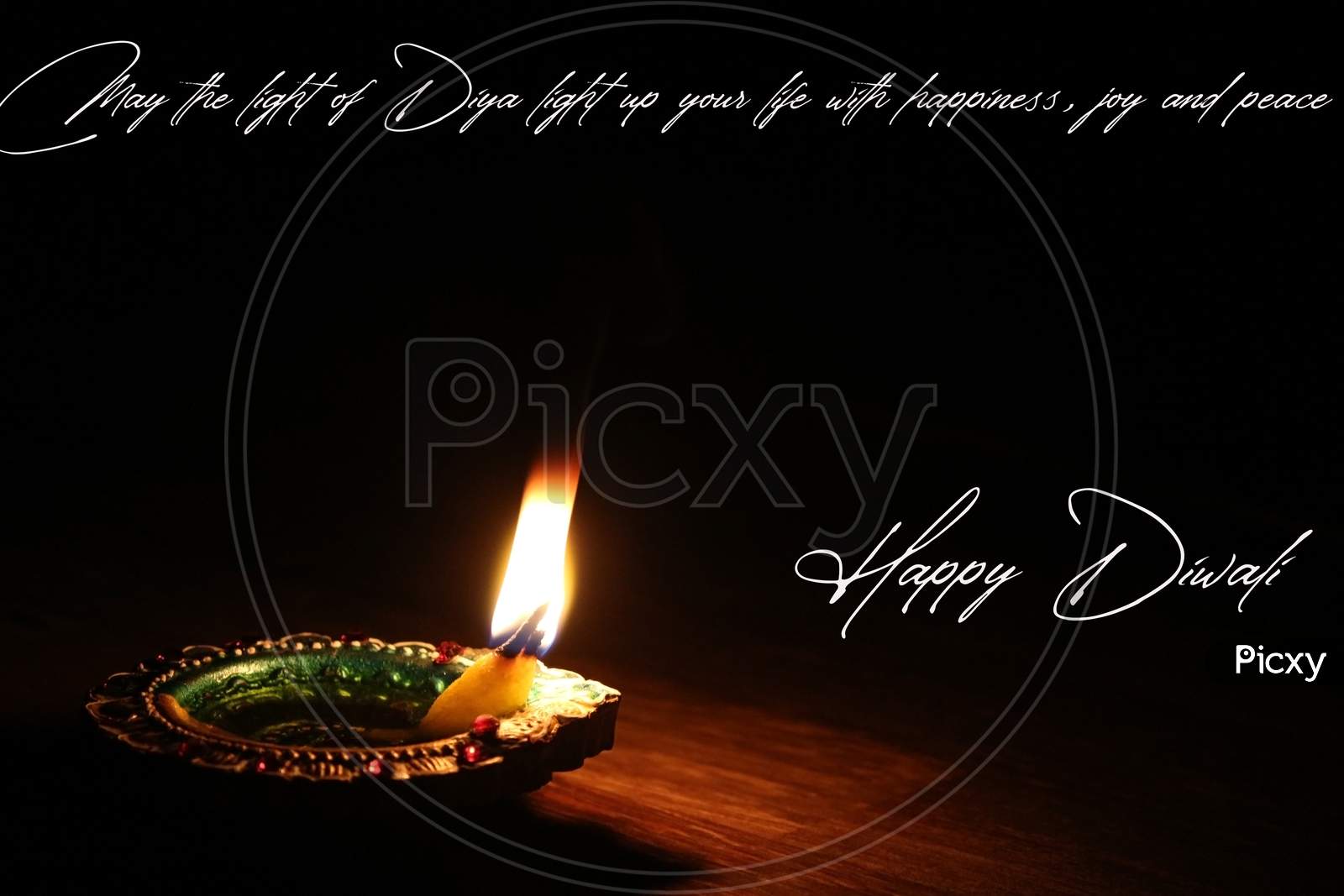 Illustration of happy Diwali wish card greeting with a glowing oil lamp