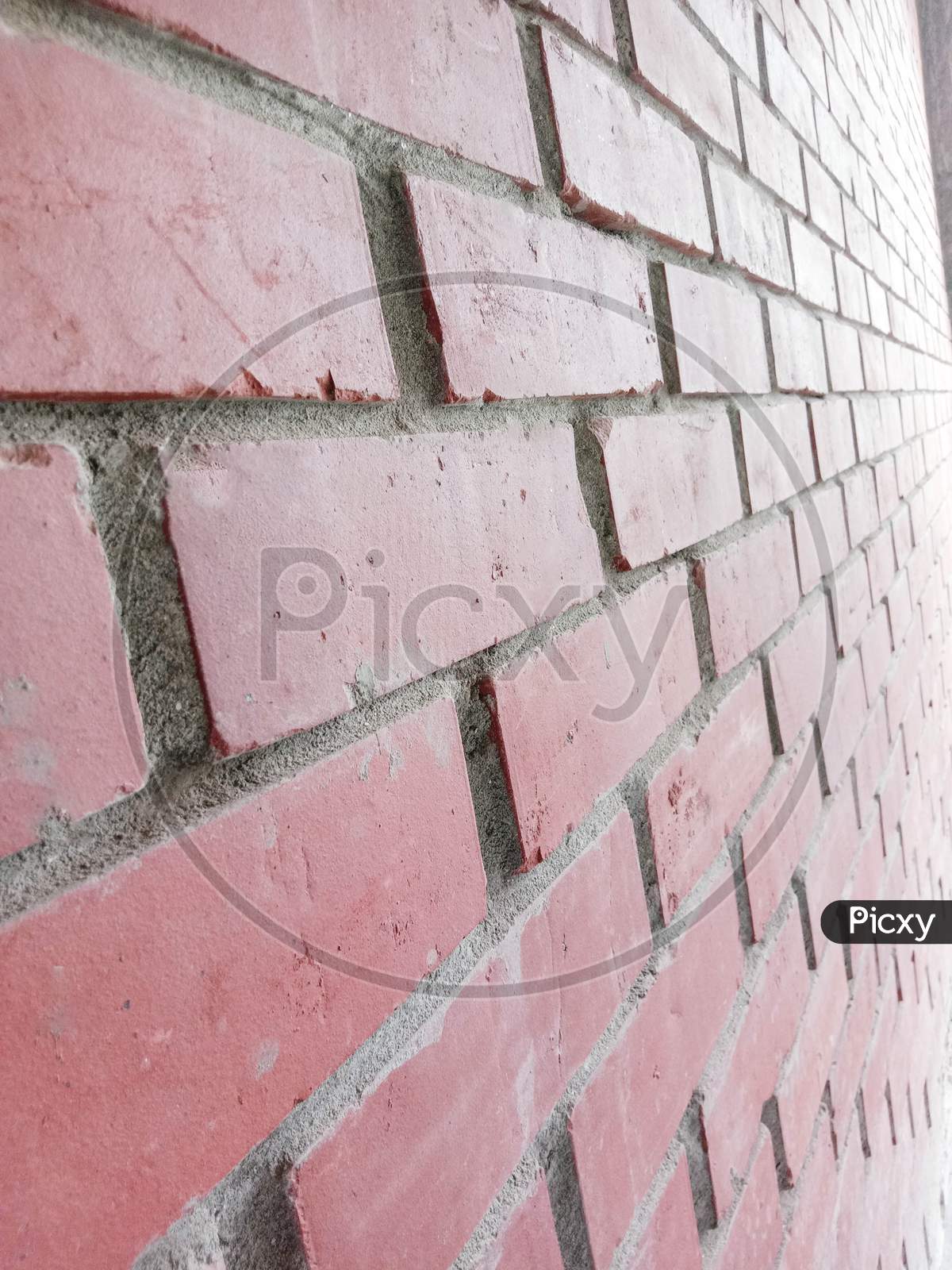 Red Colored Bricks Wall Closeup