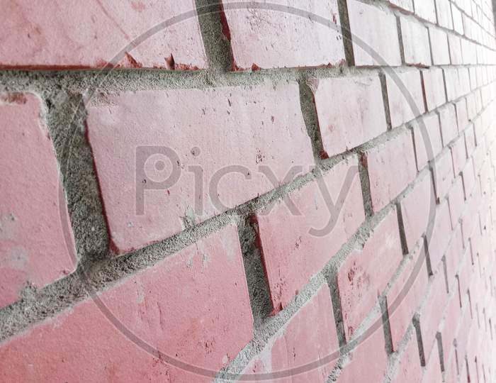 Red Colored Bricks Wall Closeup