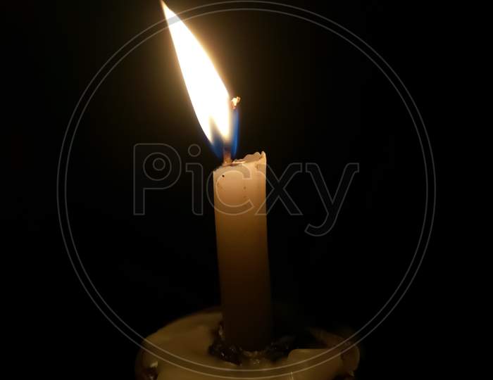 A Burning Candle in the Dark
