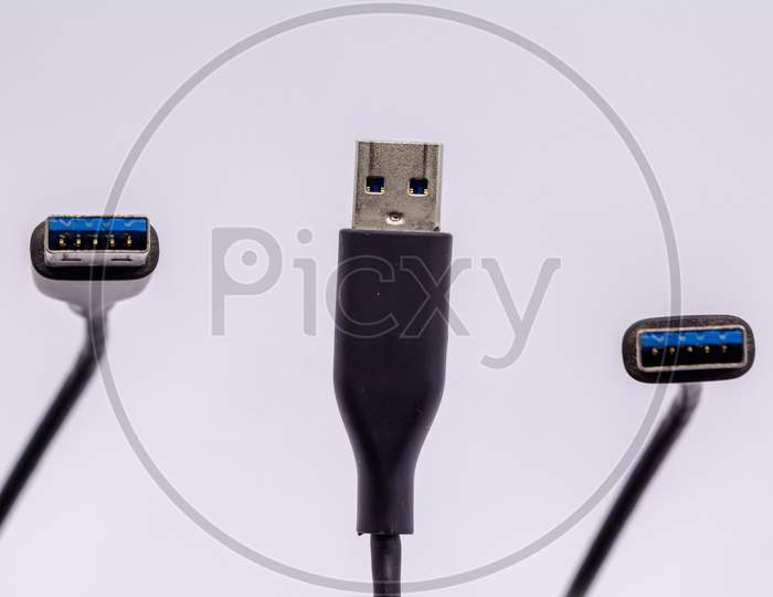 Usb Cable From Different Angles Isolated Against White Background.