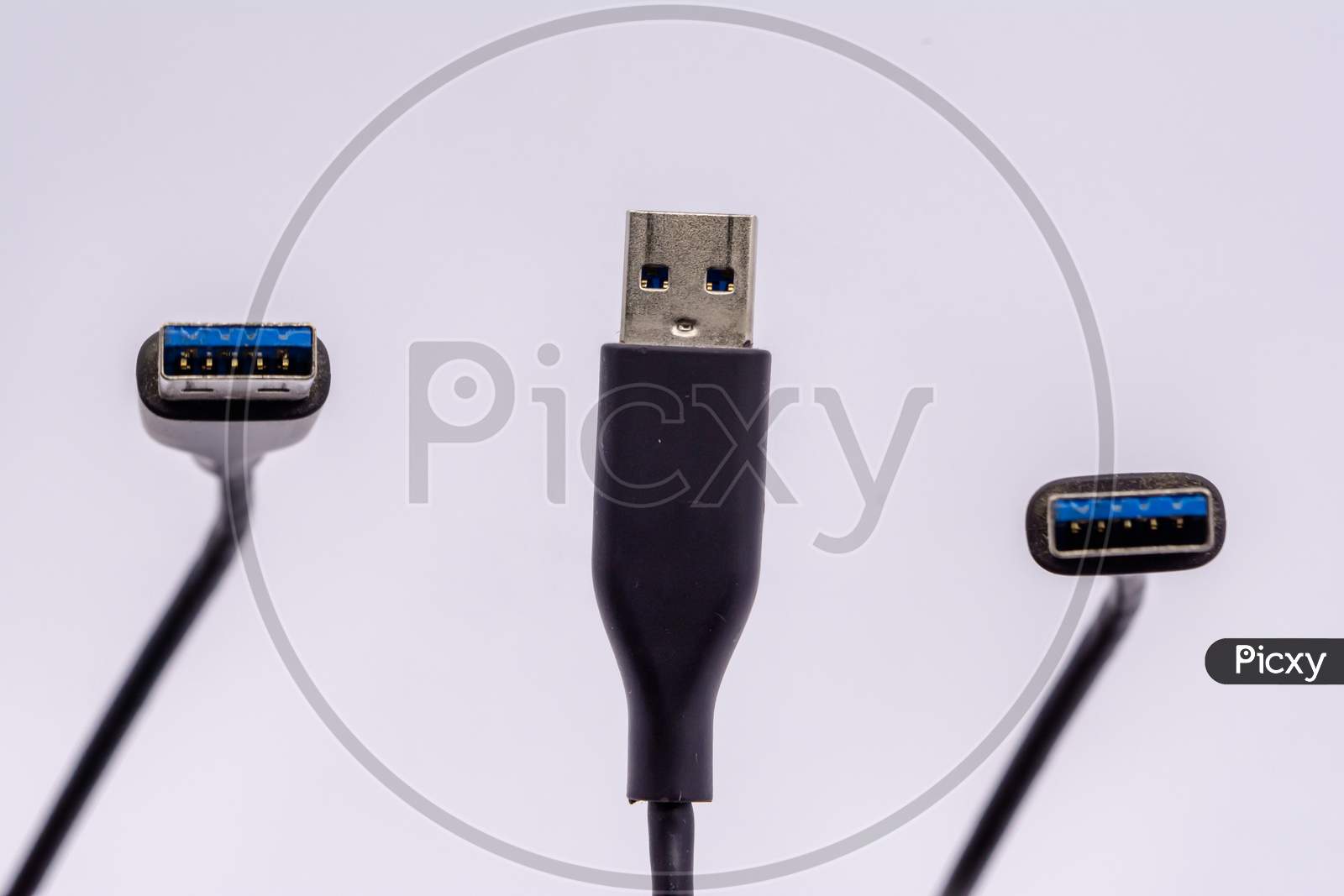 Usb Cable From Different Angles Isolated Against White Background.