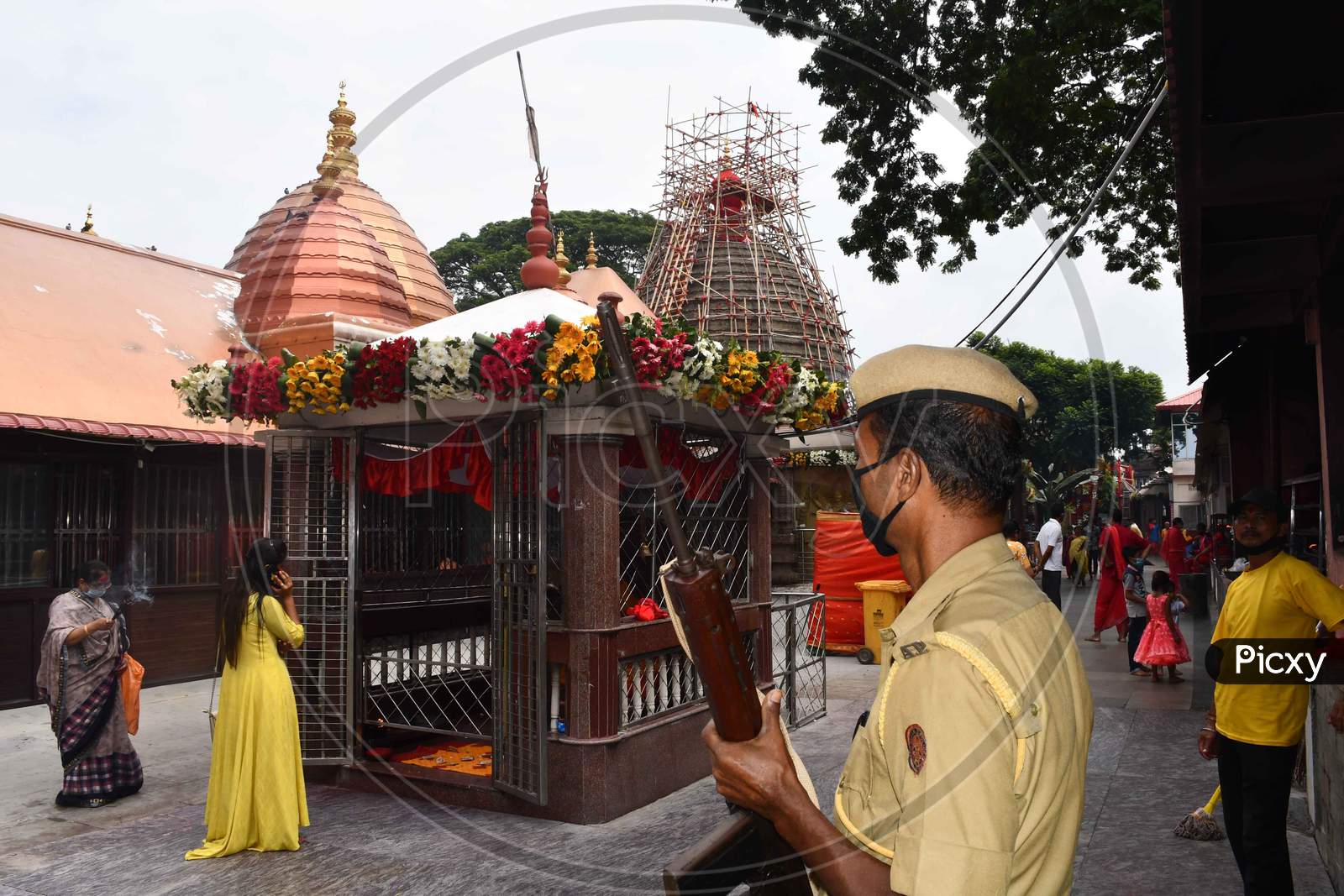 Security personal keep vigil outside the Kamakhya temple  on the occasion  of the Navratri festival, in GuwahatI On Oct 22,2020.