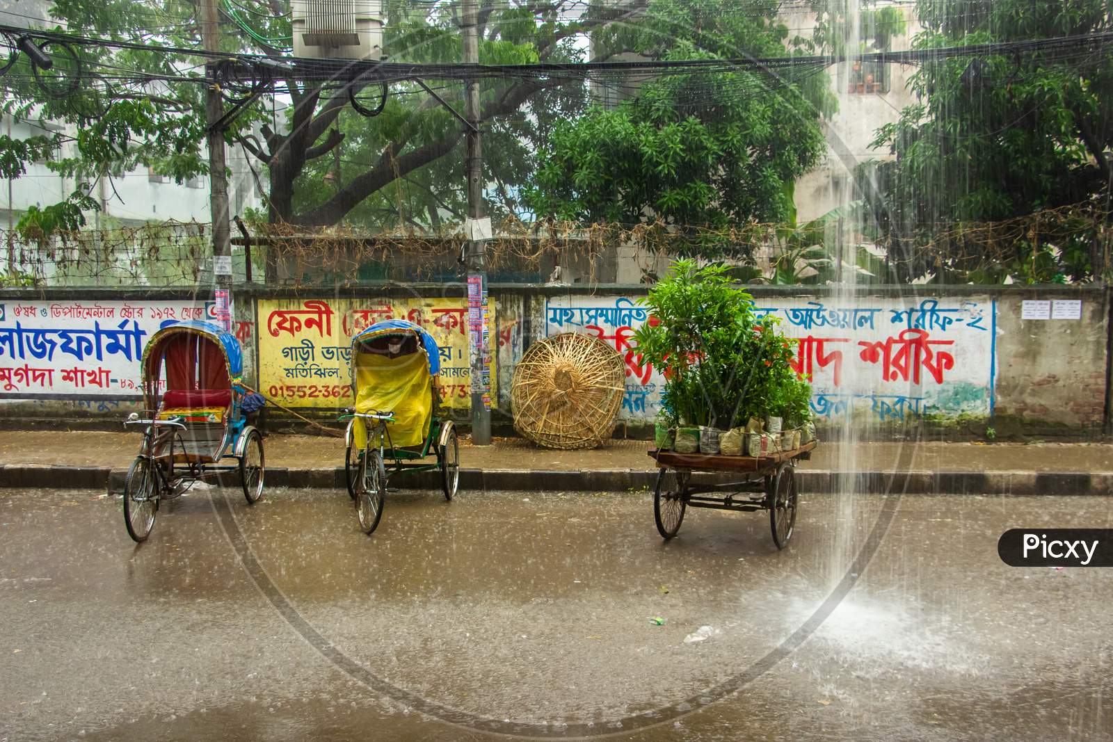 A Rainy City Street & Motion Of Rickshaw