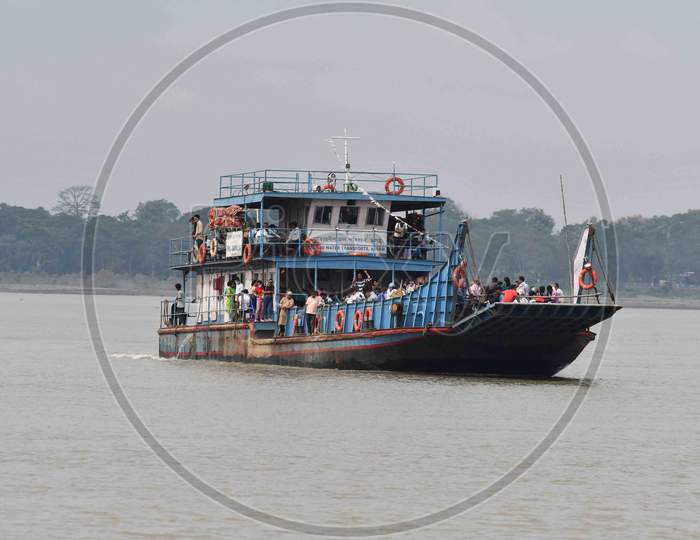 People cross the river Brahmaputra by ferryboat in Guwahati On Oct 22,2020.