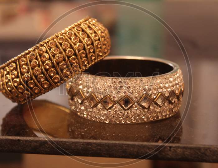 This picture shows an Indian traditional white and gold bangles