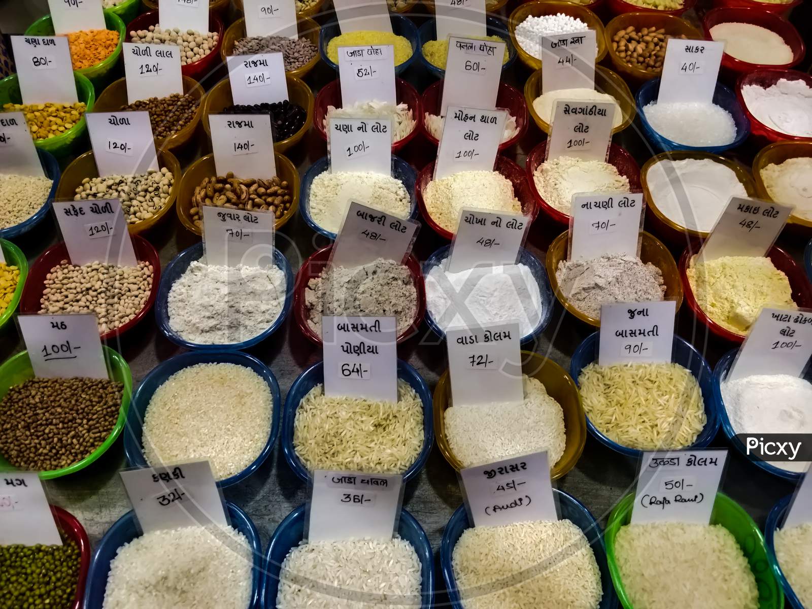 Various grains and flour for sale at a market in Mumbai