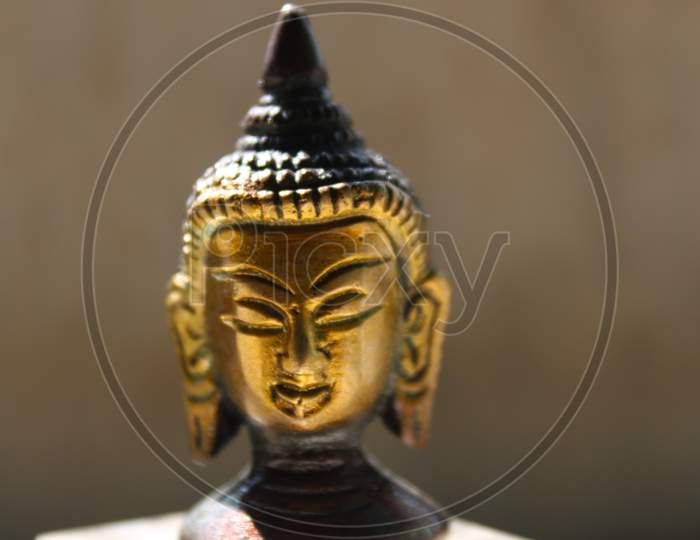 Lord Goutam Buddha golden  face  statue